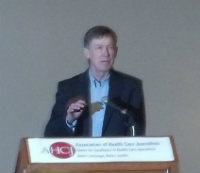 Colorado Gov. John Hickenlooper address the AHCJ conference.