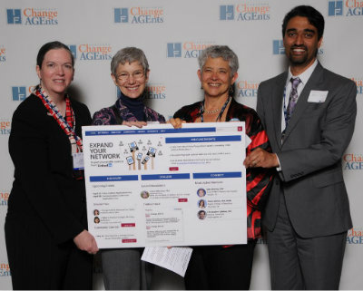 From left, Cherie Brunker, Meg Wallhagen, Rosanne Leipzig, and Aanand Naik put their pieces of the puzzle together to complete the picture at the recent Change AGEnts event at the AGS annual meeting.