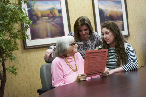 Staff at Lantern Park Nursing & Rehab Center go over the IPOST form with a resident.